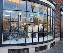 Acadia Botanicals Monroe Avenue storefront in Rochester during winter